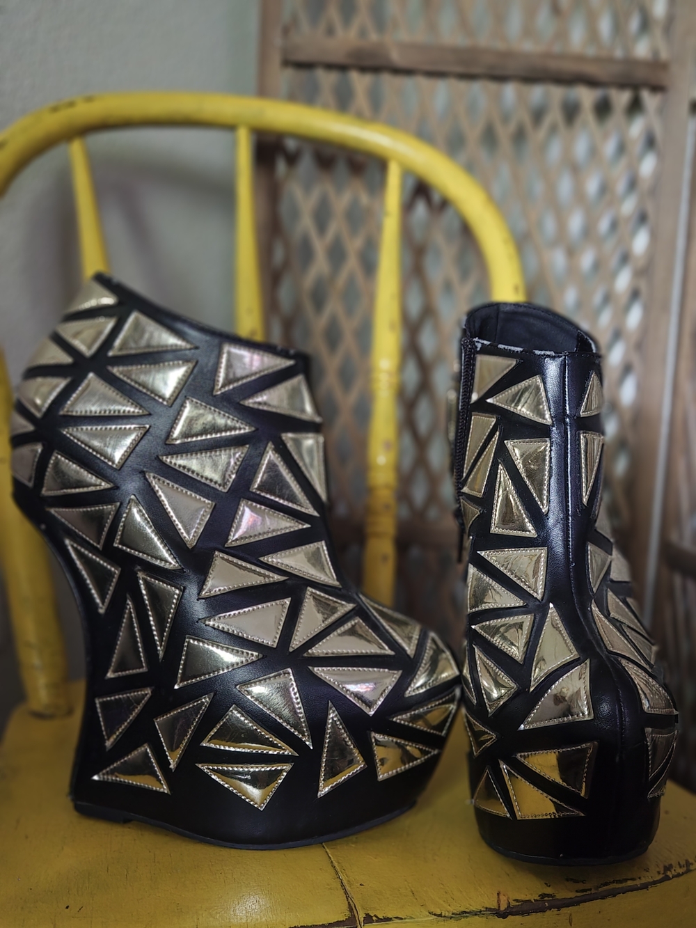Prestiged Women's Black Ankle Wedge Booties with Gold Geometric Accents